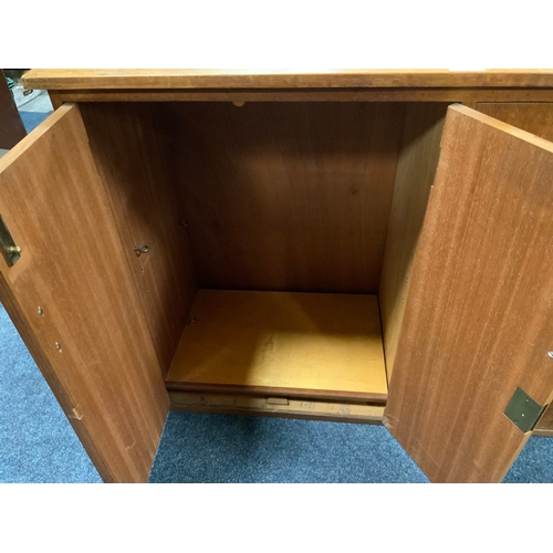 730 - A pair of mid century teak leather topped cabinets W 105 cm. (2)