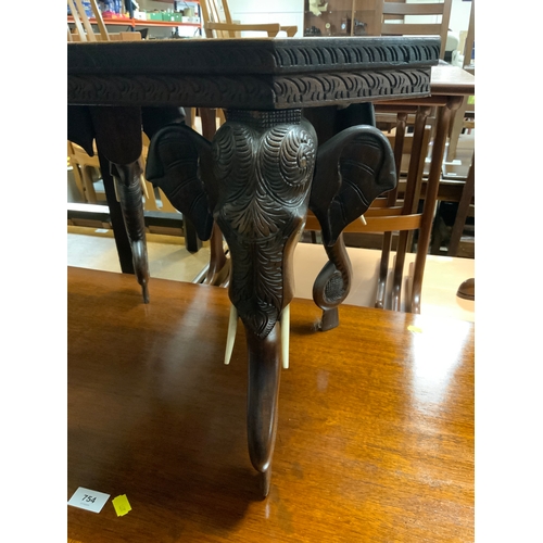 755 - An unusual carved Eastern elephant table H 43 cm W 56 cm