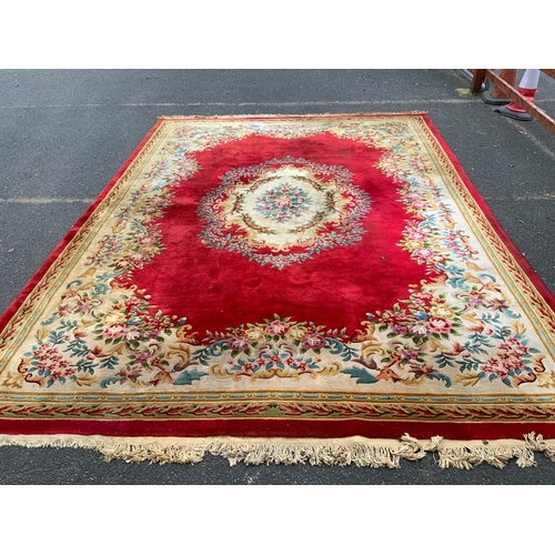 806 - A large Chinese woollen rug 430 x 305 cm