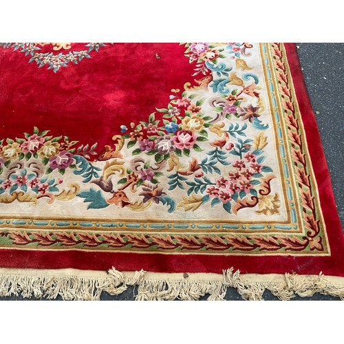 806 - A large Chinese woollen rug 430 x 305 cm