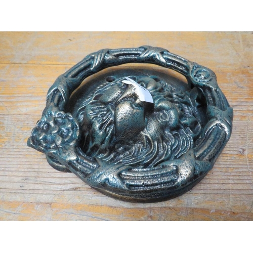 622 - A lion head door knocker**