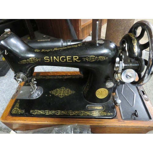 298 - A vintage cased Singer electric sewing machine EA847467 and accessories