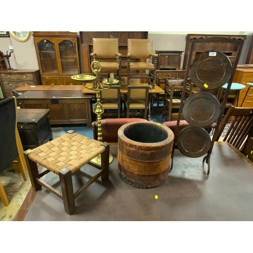 804 - An oak dumb waiter with a stool brass smokers stand and a leather covered planter. (4)