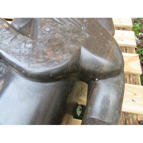 661 - A large stone  type erotic statue of a lady 'The Hugger' - H 140 cm. W 45 cm