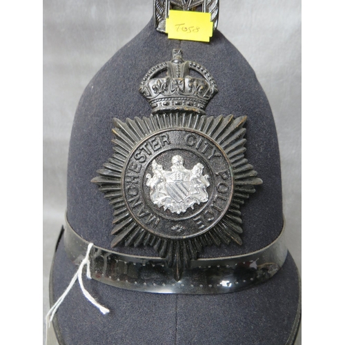 142 - A WW2 ERA MANCHESTER CITY POLICE HELMET, with blackened helmet plate