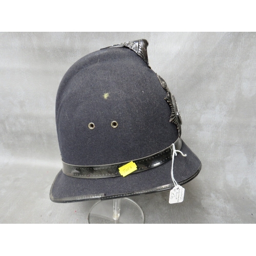 142 - A WW2 ERA MANCHESTER CITY POLICE HELMET, with blackened helmet plate