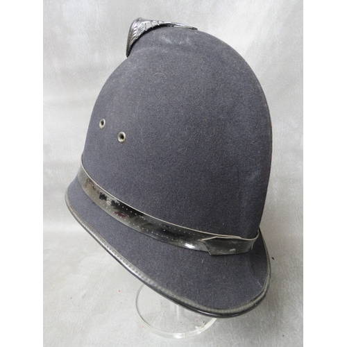 142 - A WW2 ERA MANCHESTER CITY POLICE HELMET, with blackened helmet plate