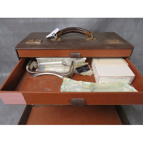 15 - A MID 20TH CENTURY MIDWIFE'S CASE AND CONTENTS, brown leather outer, fitted interior with two drawer... 