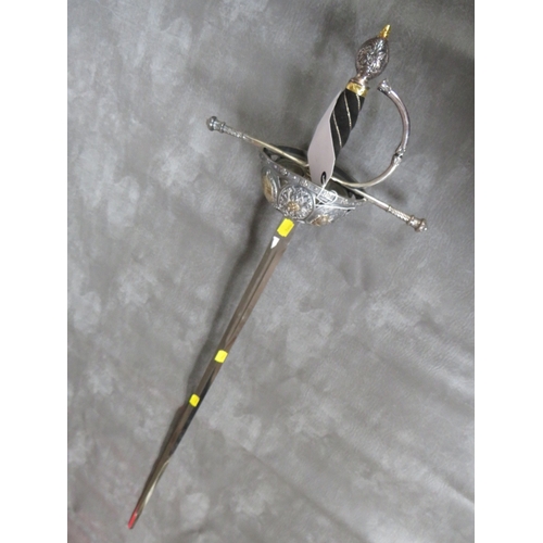 22 - A REPLICA ITALIAN STYLE RAPIER SWORD, the hilt decorated with classical busts and coats of arms, ext... 