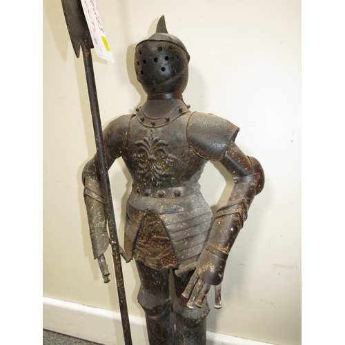 27 - A DECORATIVE METAL FIGURE OF A STANDING KNIGHT IN ARMOUR HOLDING A POLE ARM, H 89 cm