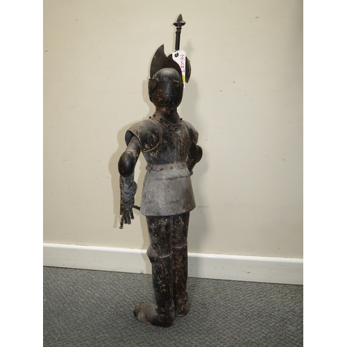 27 - A DECORATIVE METAL FIGURE OF A STANDING KNIGHT IN ARMOUR HOLDING A POLE ARM, H 89 cm