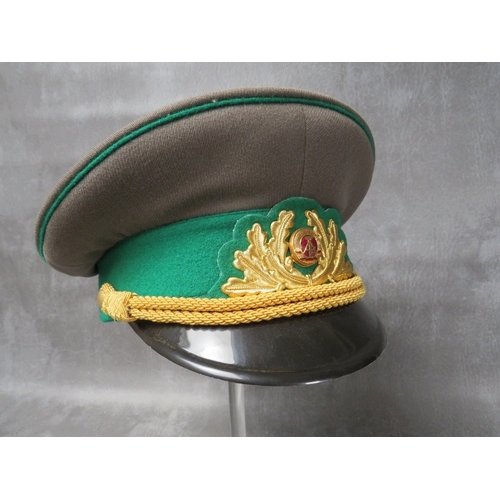 35 - THREE EAST GERMAN (GDR) OFFICERS CAPS, with gilt badges and bullion thread type bands (3)