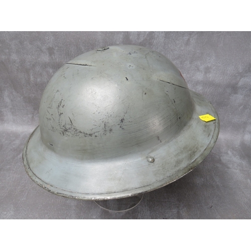 43 - A 1939 DATED BRITISH TIN HELMET, inscribed 'FIRE' to front