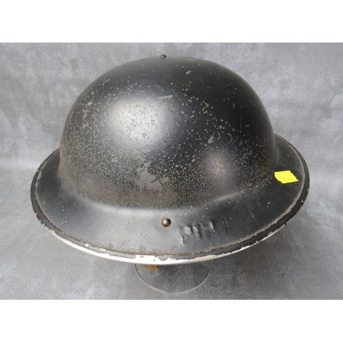 45 - A 1943 DATED BLACK PAINTED BRITISH TIN HELMET