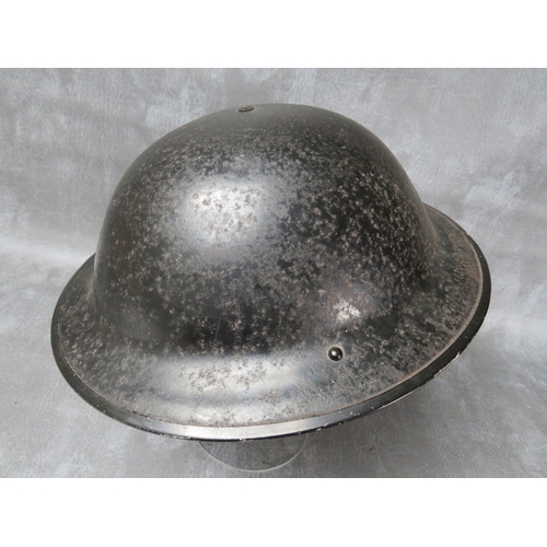 46 - A 1939 DATED BLACK PAINTED BRITISH TIN HELMET (Rubry Owen)