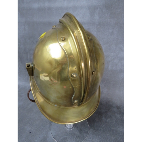 47 - A VINTAGE FRENCH BRASS FIRE HELMET, the badge inscribed 'SAPEURS POMPIERS DE BOIGNY'