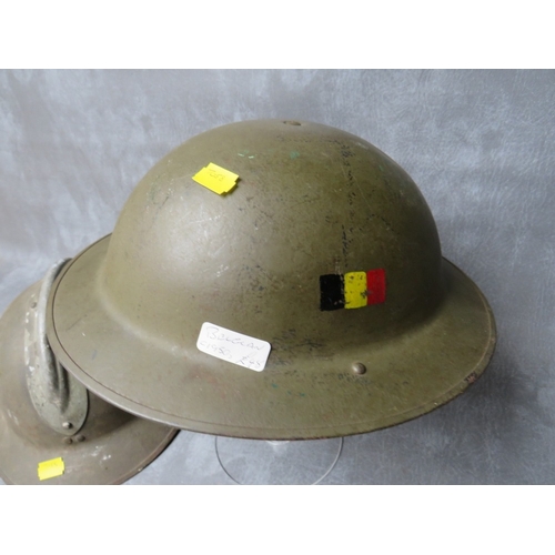 49 - A FRENCH ADRIAN TYPE HELMET SHELL, plus a 1950s Belgian type tin helmet (2)