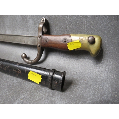 6 - A FRENCH GRAS BAYONET, dated 1879 to spine, with wooden grips, in steel scabbard, L 65.5 cm