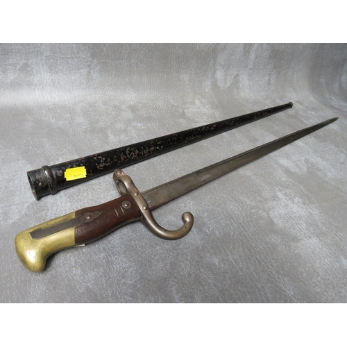 6 - A FRENCH GRAS BAYONET, dated 1879 to spine, with wooden grips, in steel scabbard, L 65.5 cm