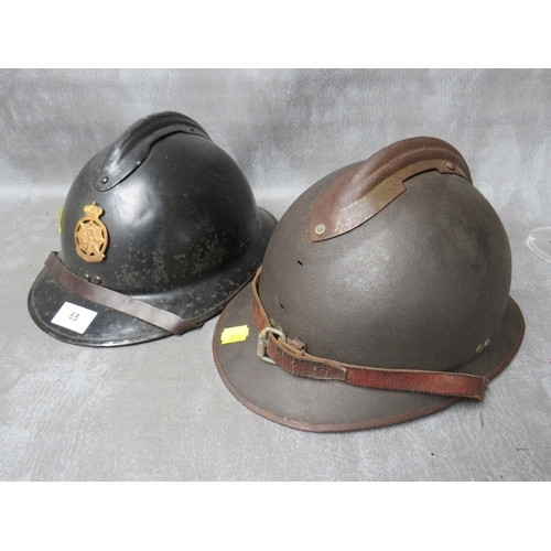 65 - AN ADRIAN TYPE HELMET, badged for Belgian Civil Defence, with black painted surfaces, together with ... 