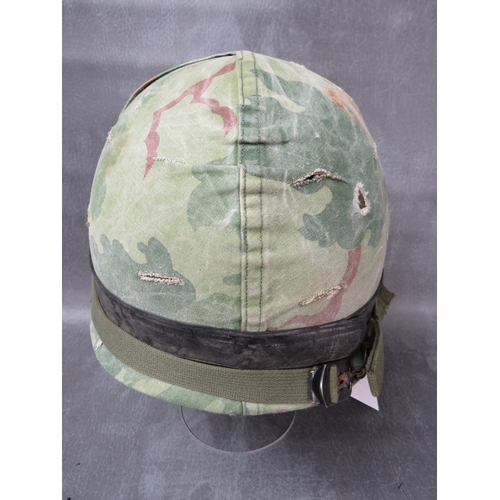 67 - A US WW2 M1 HELMET (FRONT SEAM), with 1961 Air Borne liner, with camo cover