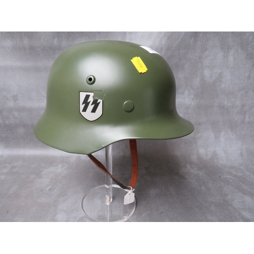 68 - A REFURBISHED WW2 GERMAN STEEL HELMET, original repainted shell with replacement chin strap and line... 