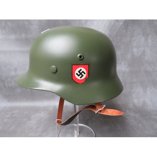 68 - A REFURBISHED WW2 GERMAN STEEL HELMET, original repainted shell with replacement chin strap and line... 