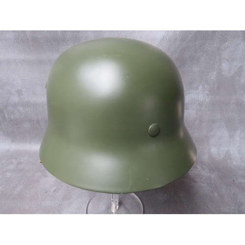 68 - A REFURBISHED WW2 GERMAN STEEL HELMET, original repainted shell with replacement chin strap and line... 