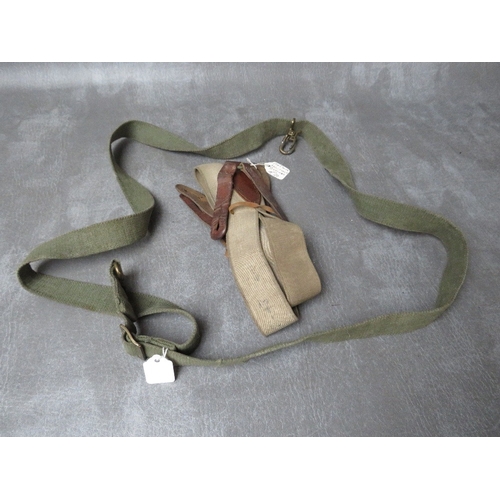 116 - A WW2 GERMAN MG42 SPARE BARREL CARRY CASE, a small enamel sign A/F, an SMG sling and a set of braces