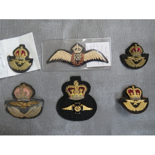 156 - R.A.F. INTEREST, consisting of WWII type cloth wings, 4 official type hat badges and an RAF chaplain... 