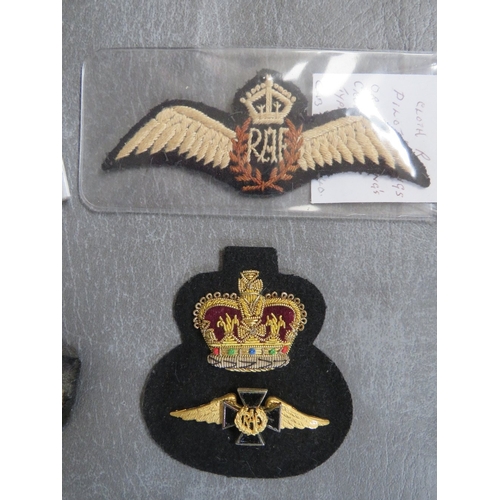 156 - R.A.F. INTEREST, consisting of WWII type cloth wings, 4 official type hat badges and an RAF chaplain... 