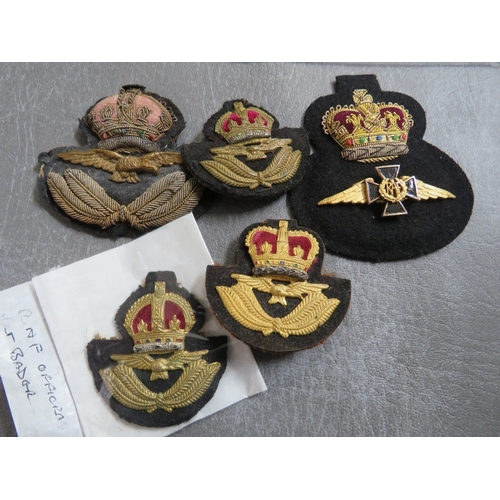 156 - R.A.F. INTEREST, consisting of WWII type cloth wings, 4 official type hat badges and an RAF chaplain... 