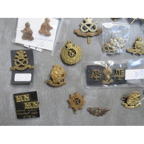 163 - A COLLECTION OF MILITARY CAP AND OTHER BADGES, to include Lancers, RA, South Staffs, US types etc.