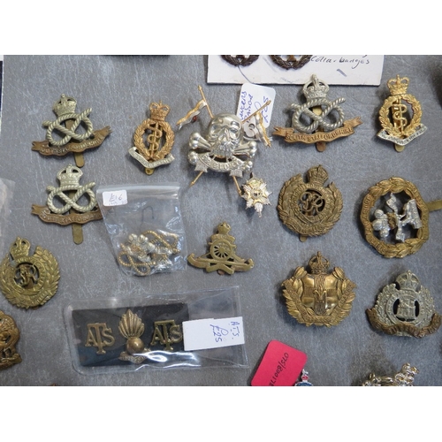 163 - A COLLECTION OF MILITARY CAP AND OTHER BADGES, to include Lancers, RA, South Staffs, US types etc.