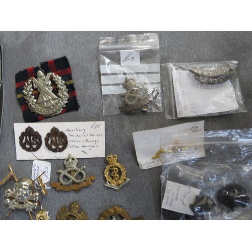 163 - A COLLECTION OF MILITARY CAP AND OTHER BADGES, to include Lancers, RA, South Staffs, US types etc.