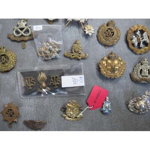 163 - A COLLECTION OF MILITARY CAP AND OTHER BADGES, to include Lancers, RA, South Staffs, US types etc.