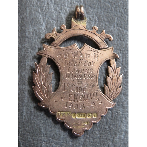 164 - A 9CT GOLD 2ND ROYAL WARWICKSHIRE REGIMENT FOB MEDAL, awarded to  Corporal C Kenzitt 1908/9