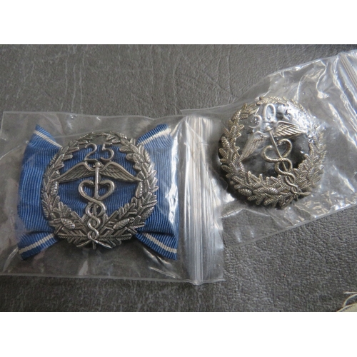 176 - TWO FINNISH CUSTOMS WHITE METAL LONG SERVICE BADGE, a post war German marksman lanyard and a boxed s... 