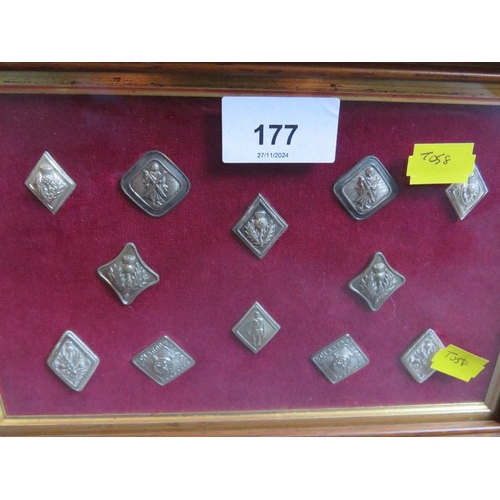 177 - A FRAME OF SCOTTISH REGIMENTAL BUTTONS, along with a Victorian volunteers buckle