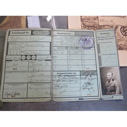 181 - A SMALL COLLECTION OF WWII GERMAN EPHEMERA & BOOKS, to include voluntary work pass, workbook with co... 