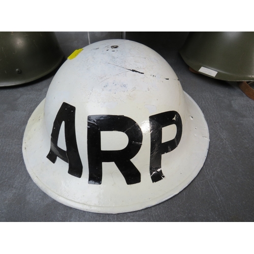 59 - FOUR TIN HELMETS, consisting of a British WW2 era shell, Czech Army, French Para type and WW2 Swiss ... 