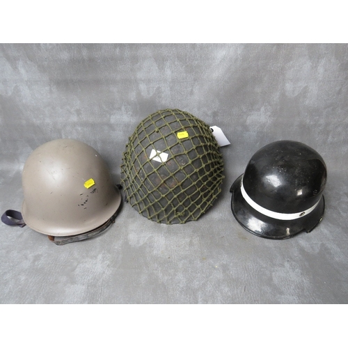 66 - A BRITISH TURTLE TYPE TIN HELMET, (1952 by Rubry Owen), together with a French helmet dated 1964 (wi... 