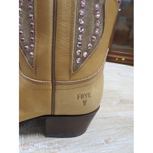 121 - A pair of FRYE hand crafted cowboy boots, light coloured leather with pink rhinestone embellishment,... 