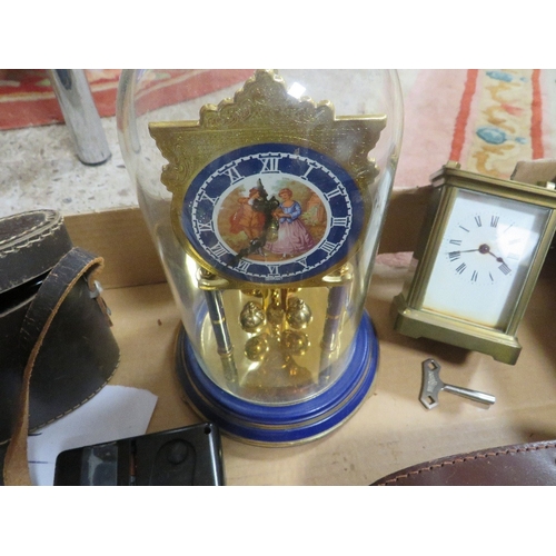 135 - A tray of vintage clocks and binoculars etc 136