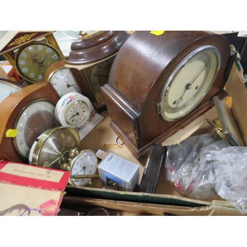 165 - Three trays of collectables and sundries to include metal ware and a tray of assorted clocks