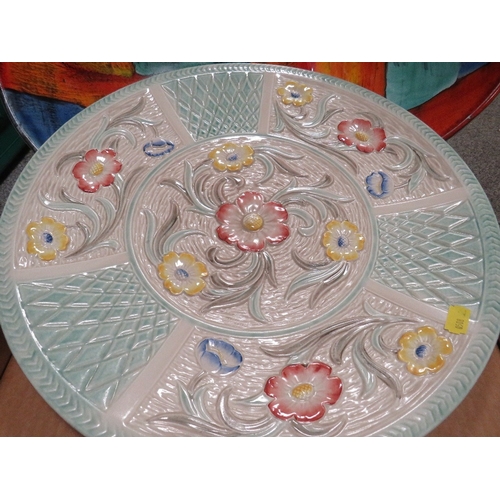 199 - A large Poole dish together with a similar damaged example and a charger (3)