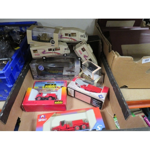 203 - Four boxed Solido military vehicles, three boxed Oxford military vehicles and three plastic camper v... 