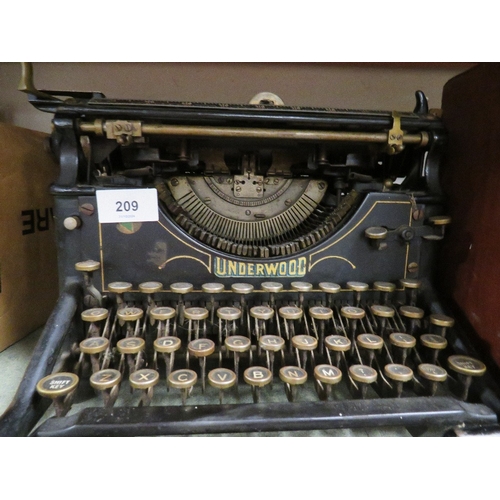 209 - An antique underwood number 5 typewriter together with a vintage radio A/F