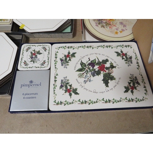 219 - A tray of various placemats together with a box of napkins etc