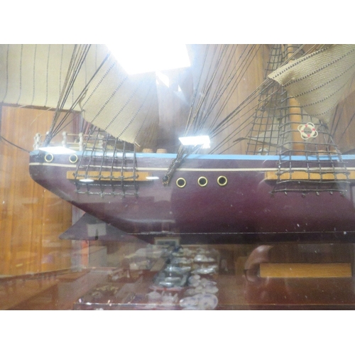 79 - A model of a tall sail ship in a bespoke glass display case